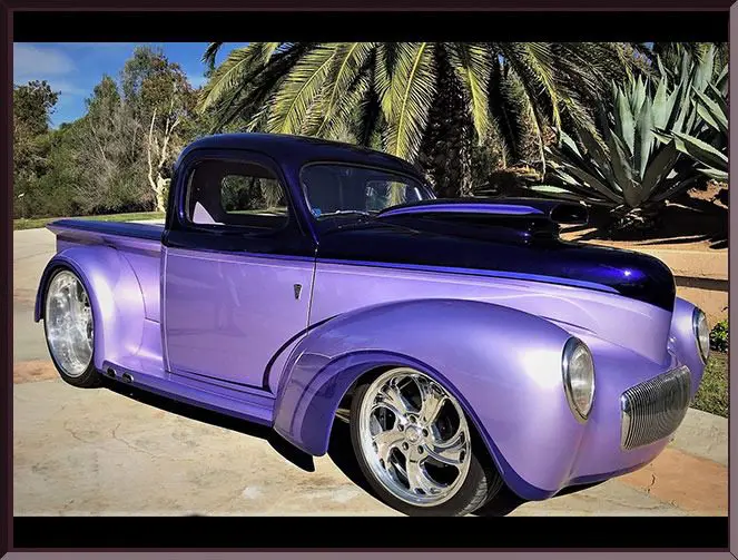 Custom purple truck with lush backdrop