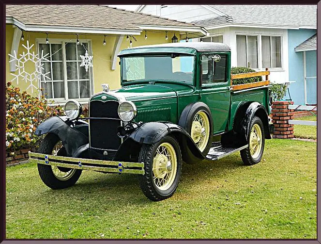 Vintage green truck on grassy yard