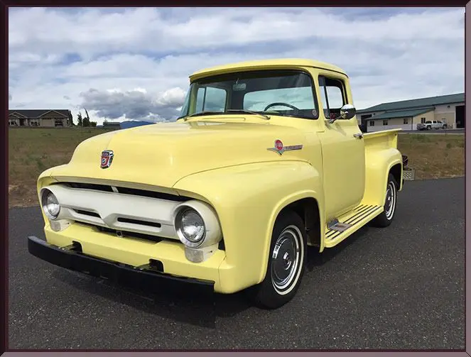 Classic yellow truck parked outside