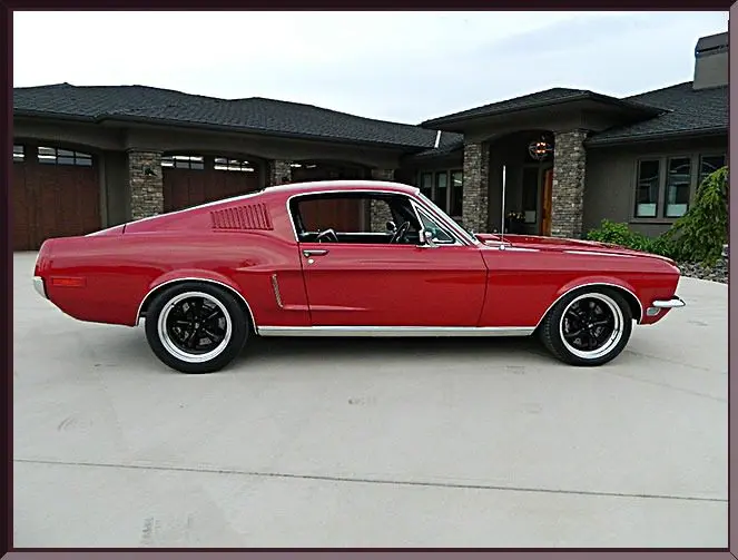 Retro red vehicle near contemporary home
