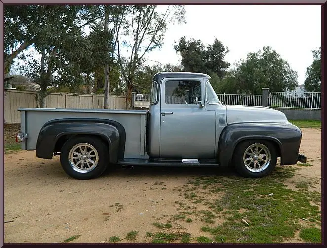 Classic silver truck with trees