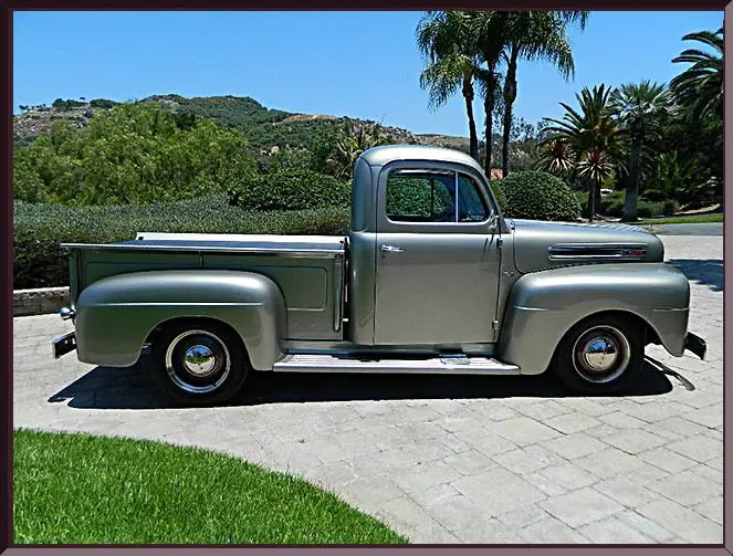 Retro pickup with lush landscape backdrop