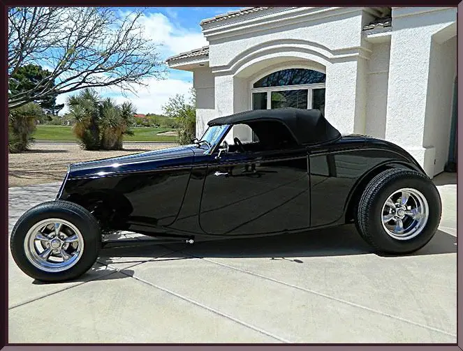 Retro convertible car in driveway