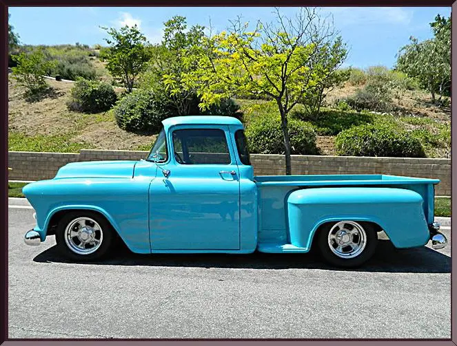 Vintage blue pickup truck on a sunny day