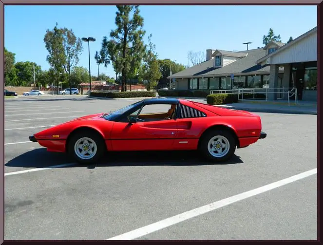 Red sports car in parking lot