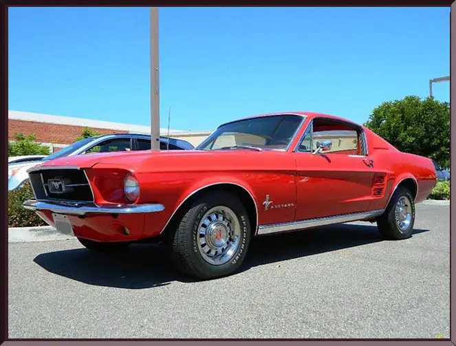 Shiny red vintage car in sunlight