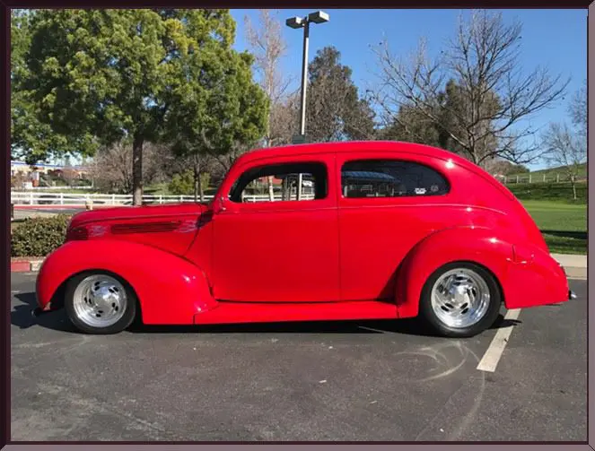 Classic red car under blue sky