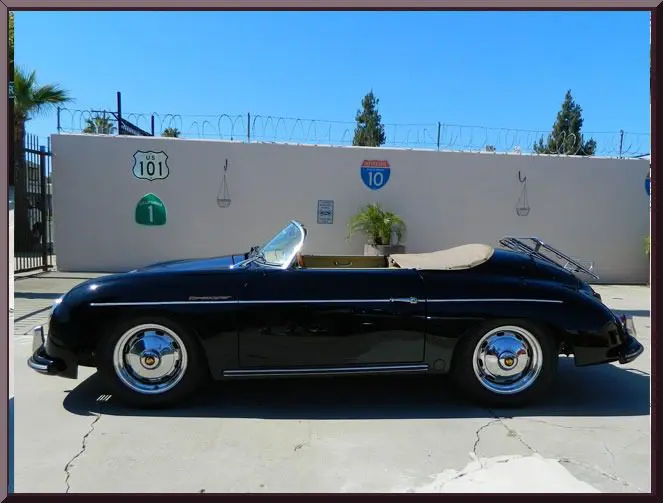 Classic car beside highway signs