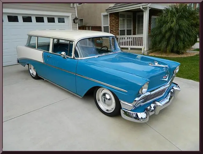 Retro station wagon parked in driveway