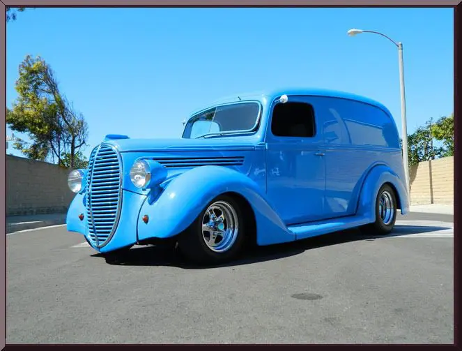 Vintage blue delivery van on street
