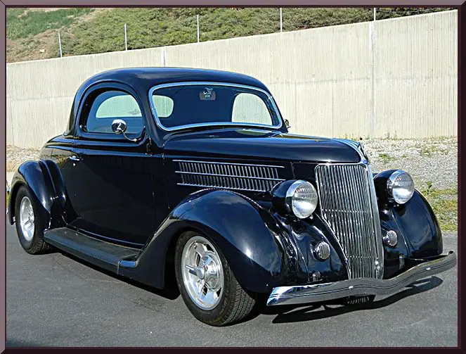 Shiny retro coupe parked outdoors