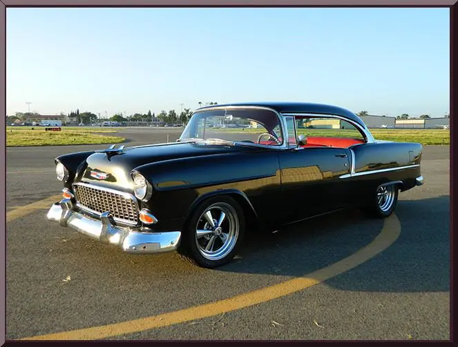 Retro car parked on asphalt road