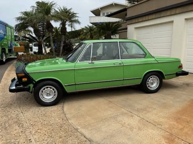 Classic car near palm trees