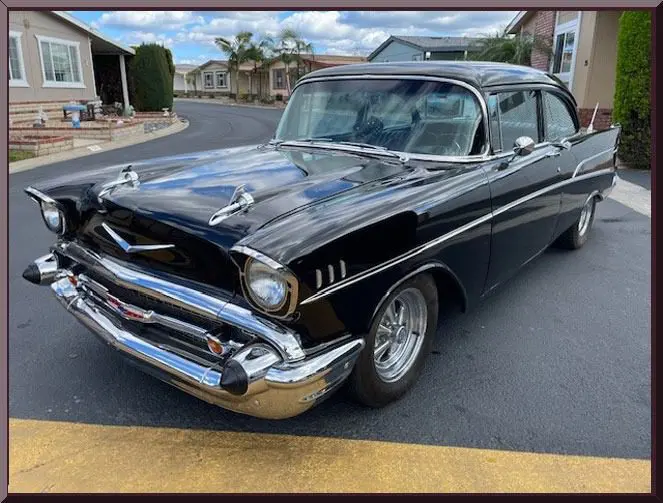 Shiny black retro car in neighborhood