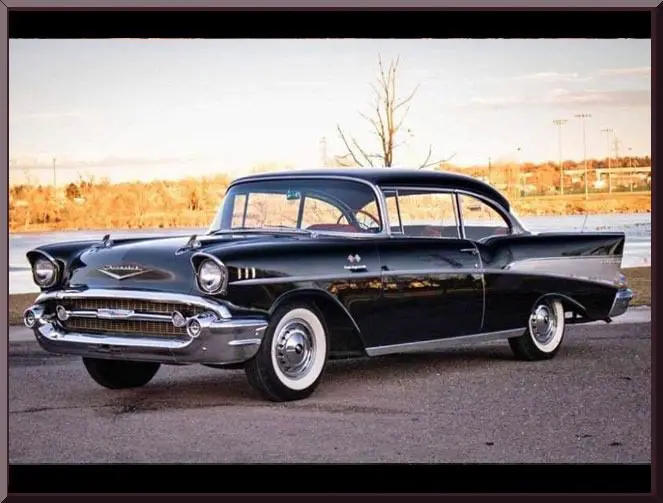 Classic black vintage car in parking lot