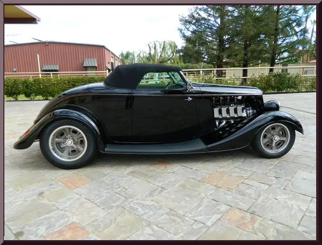 Black retro convertible with top up.