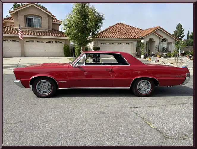 Red classic car parked on street