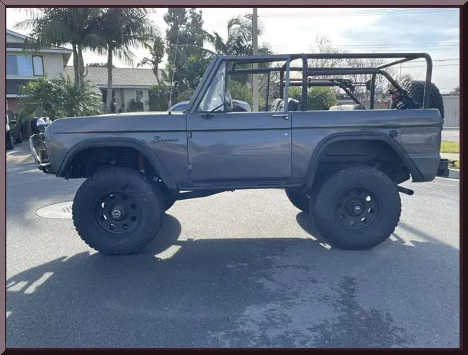 Gray open-top truck on street