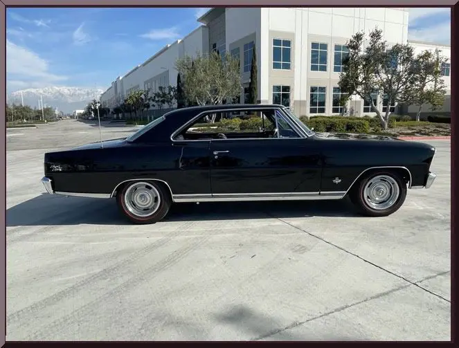 Black vintage two-door muscle car outdoors