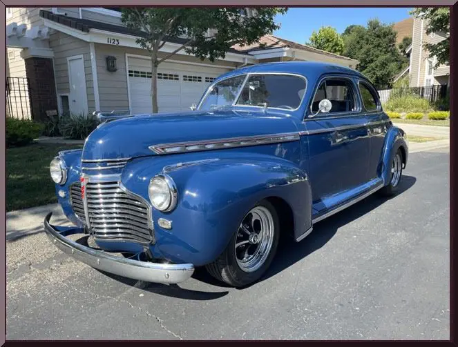 Vintage blue car parked on street