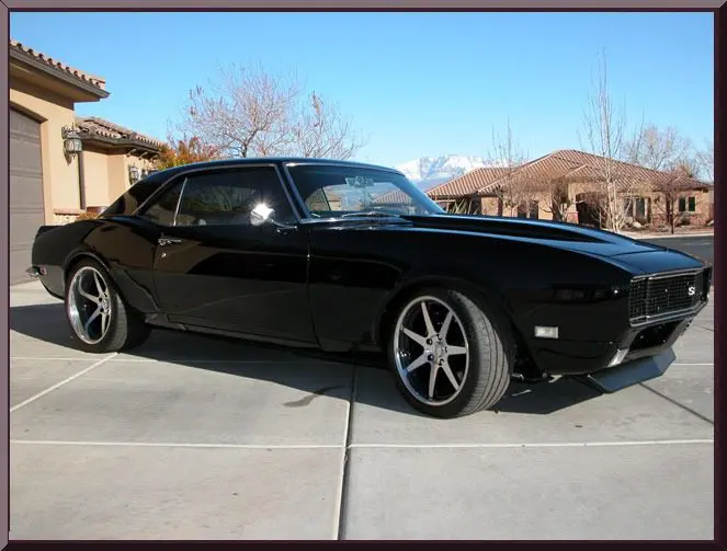 Vintage black sports car on driveway