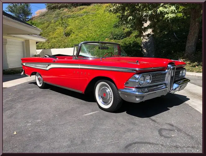 Red classic convertible parked outdoors